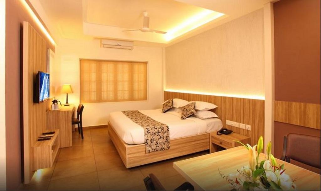 Hotel Luciya Palace Thrissur Phòng bức ảnh